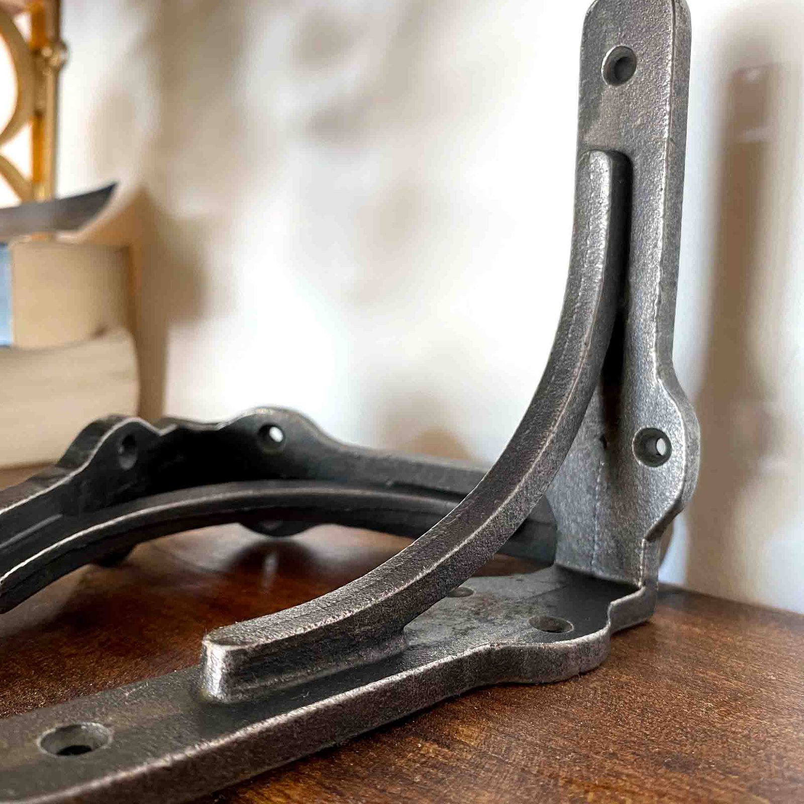 cast iron shef brackets sat on a shelf