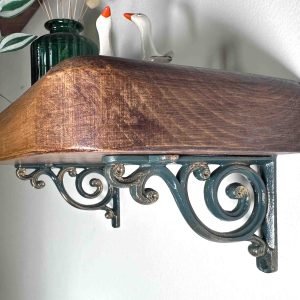 Green and gold shelf bracket