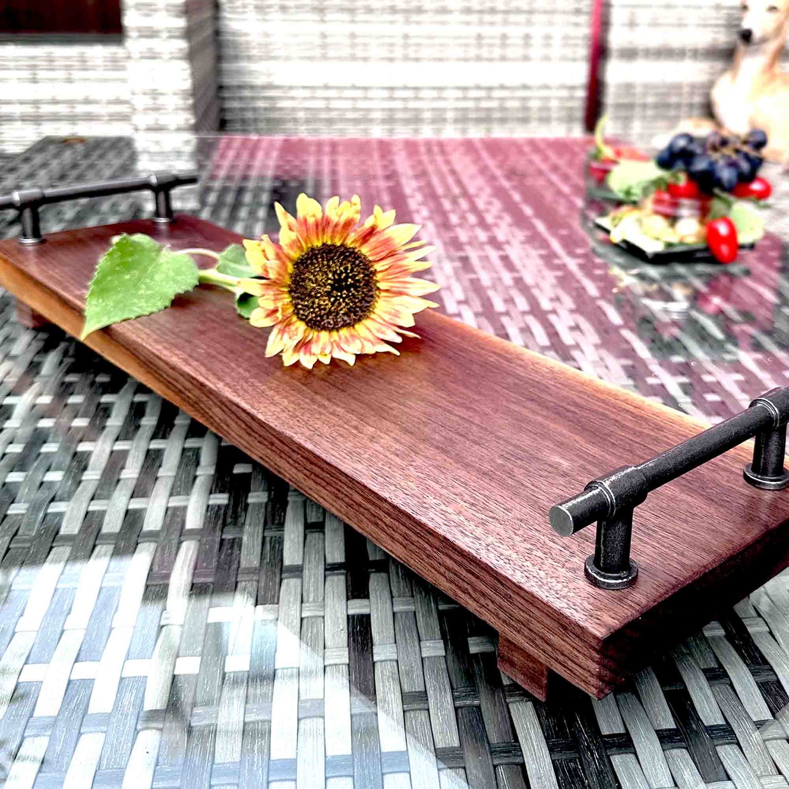 walnut serving tray with cast iron handles and a sunflower