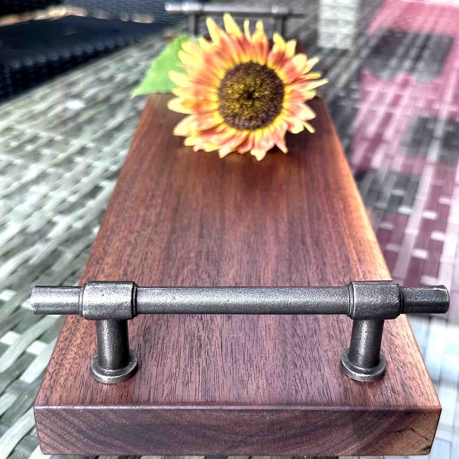 walnut serving tray with cast iron handles and a sunflower