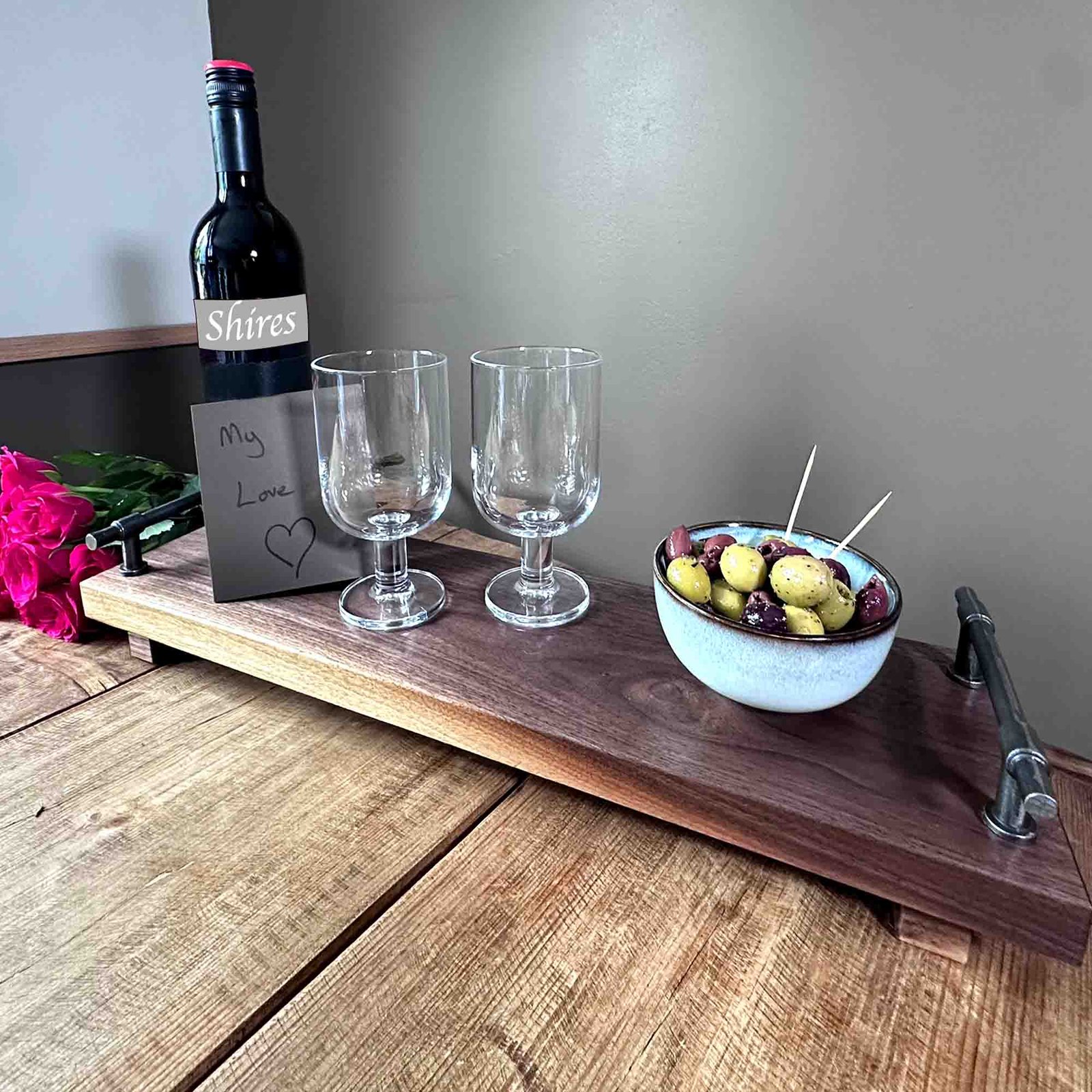walnut serving tray with cast iron handles a gift with wine and olives