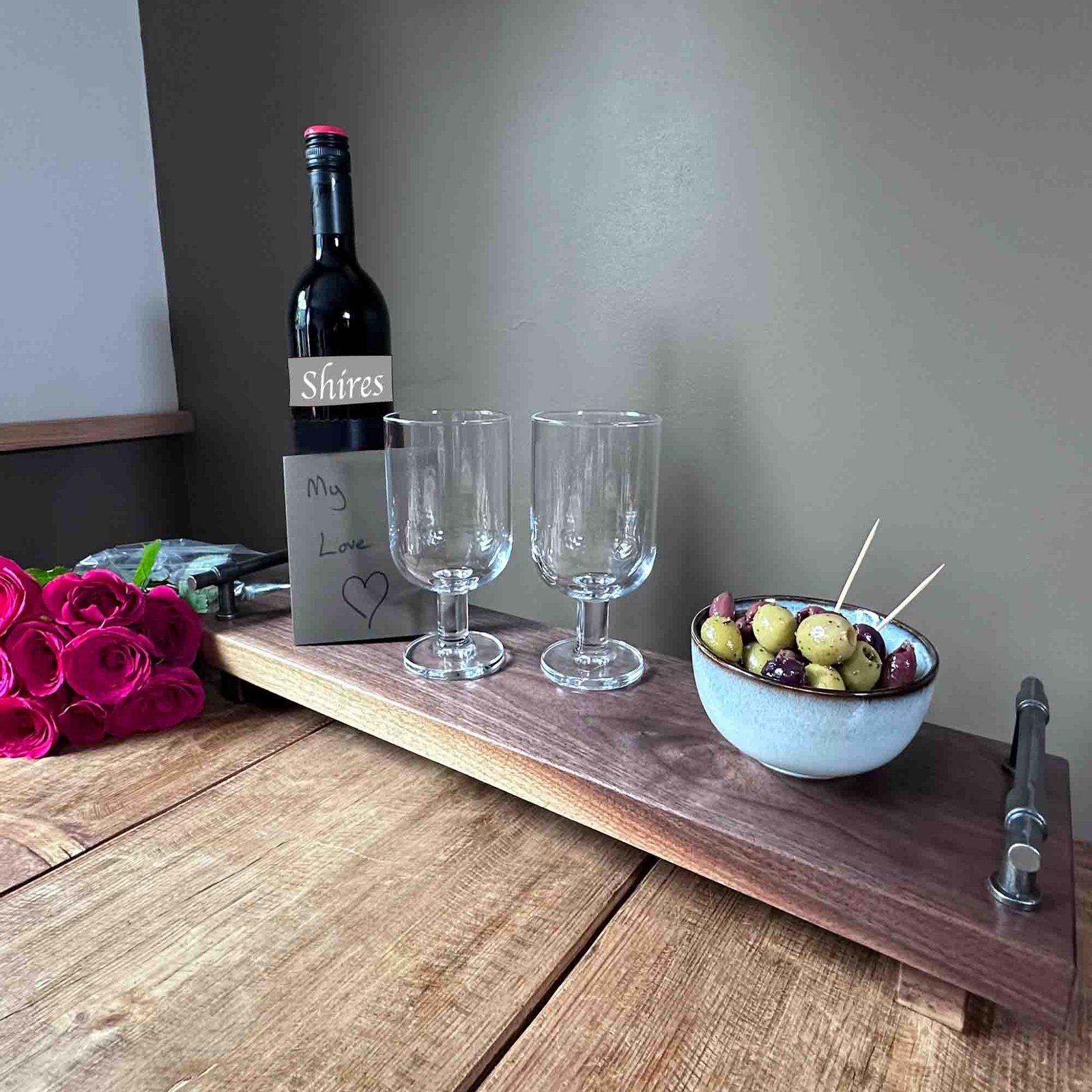 walnut serving tray with cast iron handles a gift with wine and olives