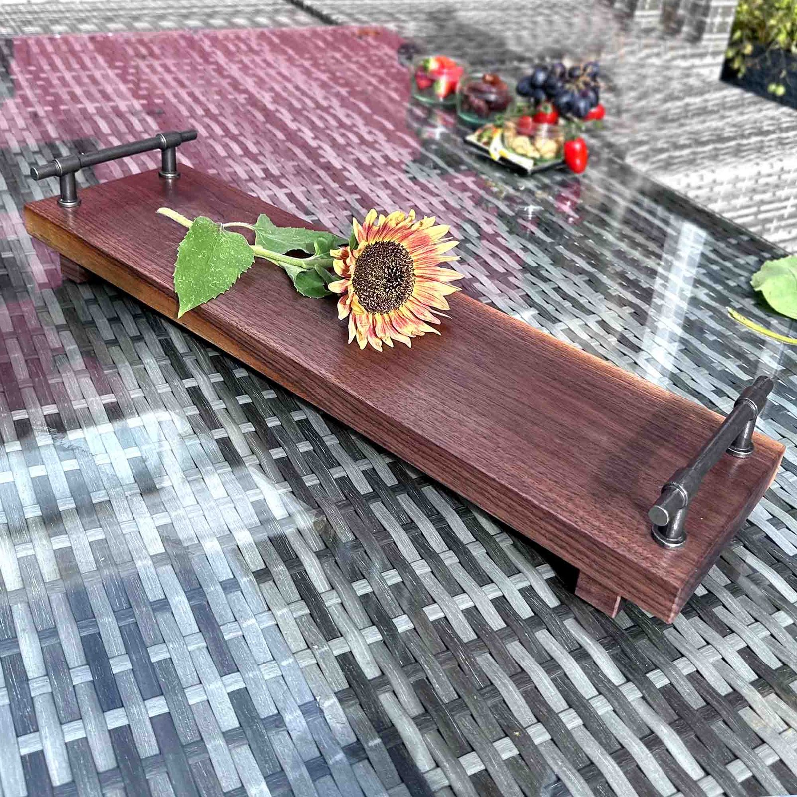 walnut serving tray with cast iron handles and a sunflower
